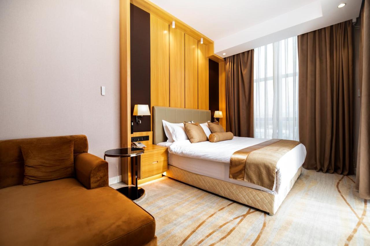 Hotel Diamond Prishtina Pristina Exteriör bild A bedroom at the hotel