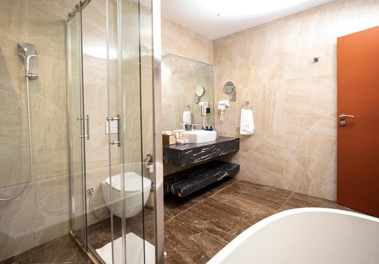 Hotel Diamond Prishtina Pristina Exteriör bild A bathroom in a hotel