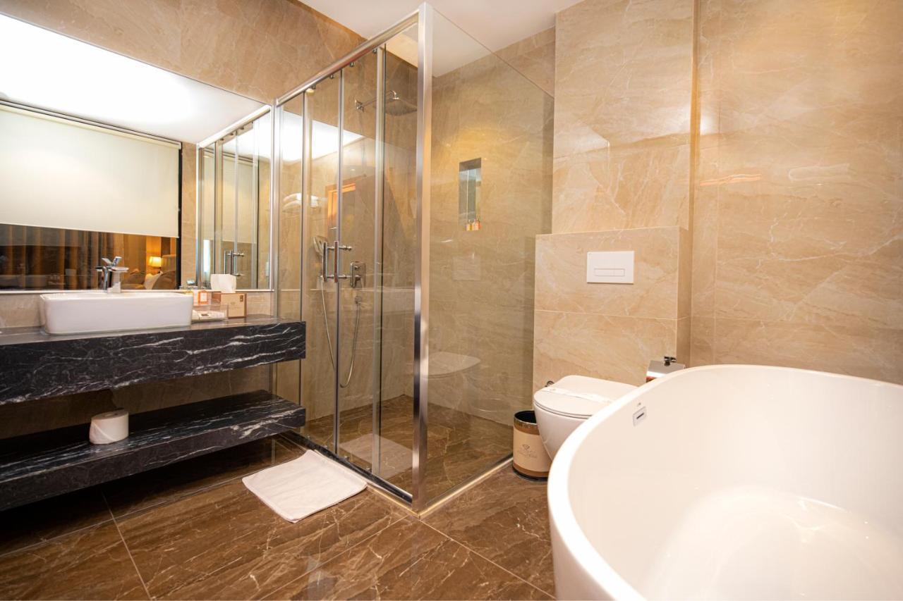 Hotel Diamond Prishtina Pristina Exteriör bild A bathroom with a shower enclosure