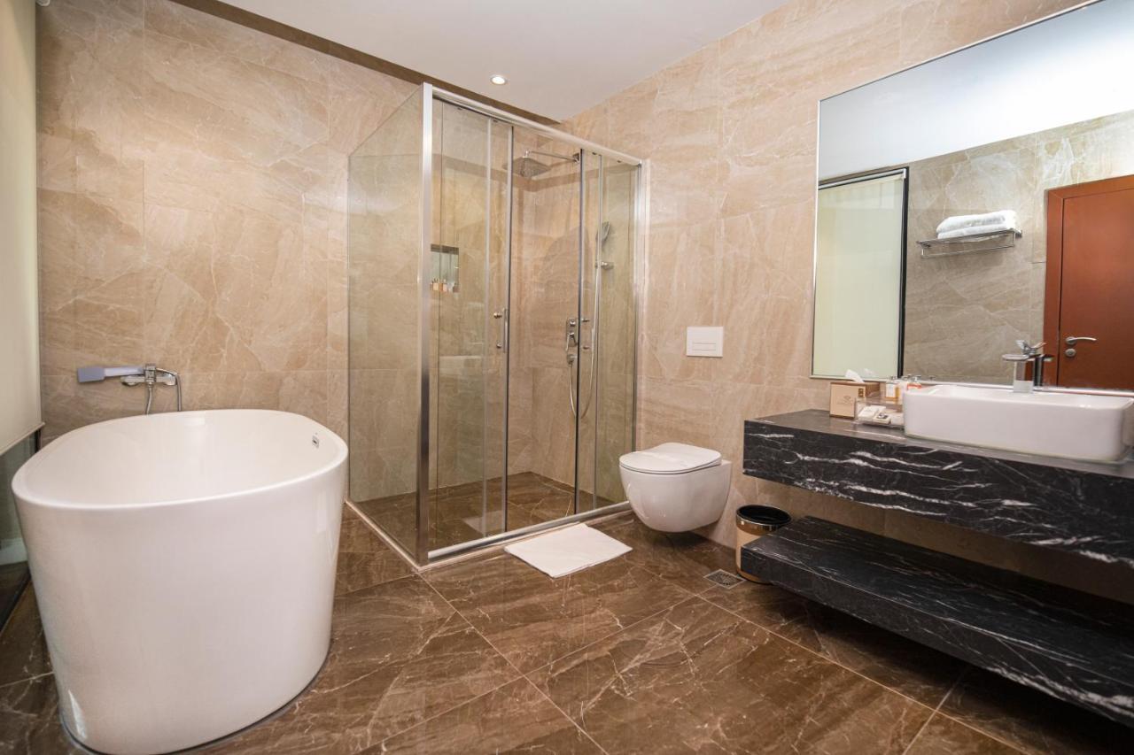 Hotel Diamond Prishtina Pristina Exteriör bild A modern bathroom