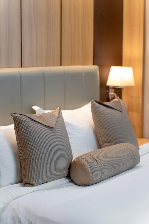 Hotel Diamond Prishtina Pristina Exteriör bild Pillows on a bed